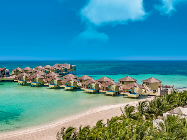 Discover Tropical Romance in 3 Overwater Bungalow Resorts on the Caribbean Sea